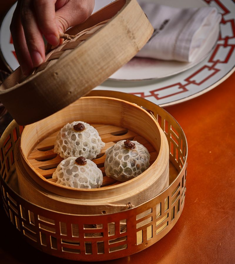Dim Sum Steamed Buns at Chinese Restaurant Awards Steamed dim sum buns in bamboo steamer at Chinese Restaurant Awards.