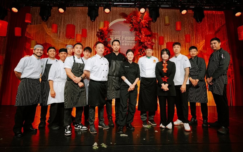 Group of chefs and staff at Chinese Restaurant Awards event on stage.