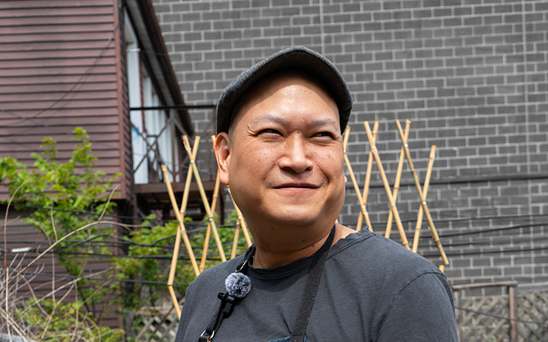 Smiling man at Chinese Restaurant Awards event in Toronto.