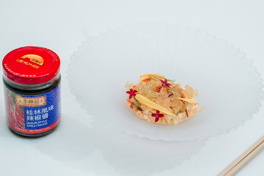 Chinese Restaurant Awards - Gourmet Dish Elegant Chinese dish with floral garnishes on a white plate.
