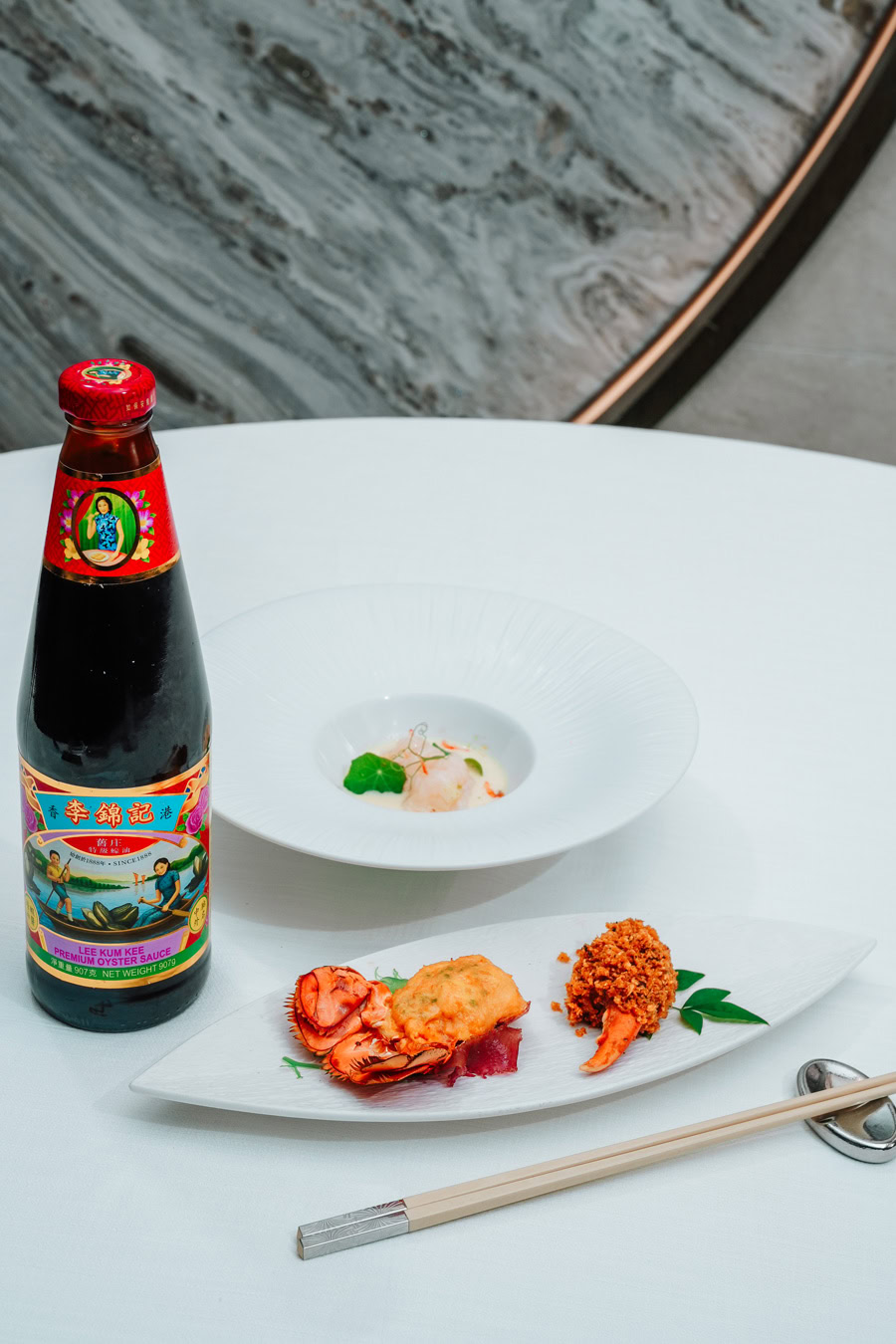 Chinese Restaurant Awards Dish Elegant Chinese dish with soy sauce bottle and seafood.