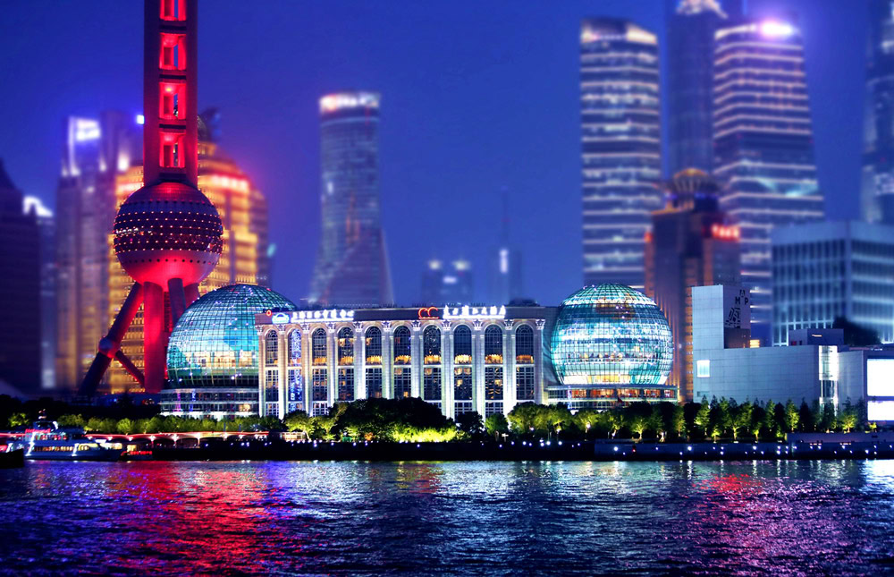 Shanghai Skyline at Night Night view of Shanghai skyline with illuminated buildings and river.