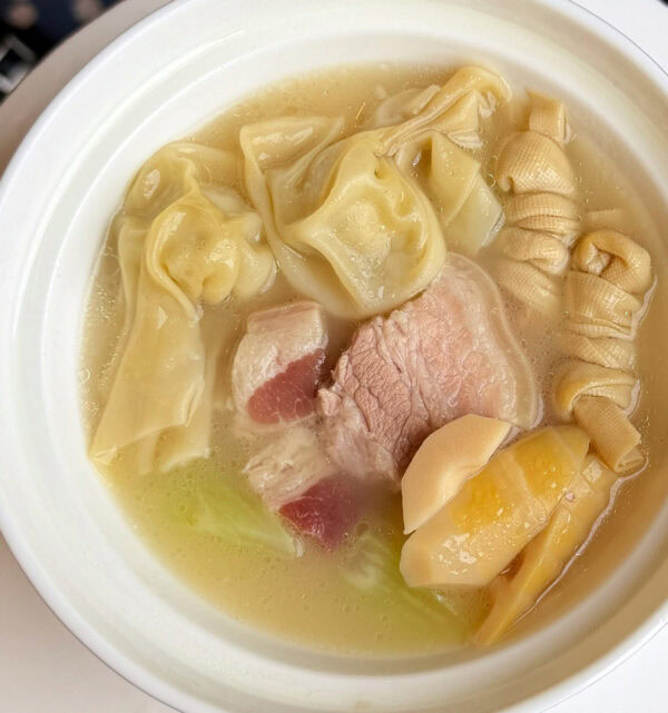 Chinese Dumpling Soup Traditional Chinese dumpling soup with pork and bamboo shoots.
